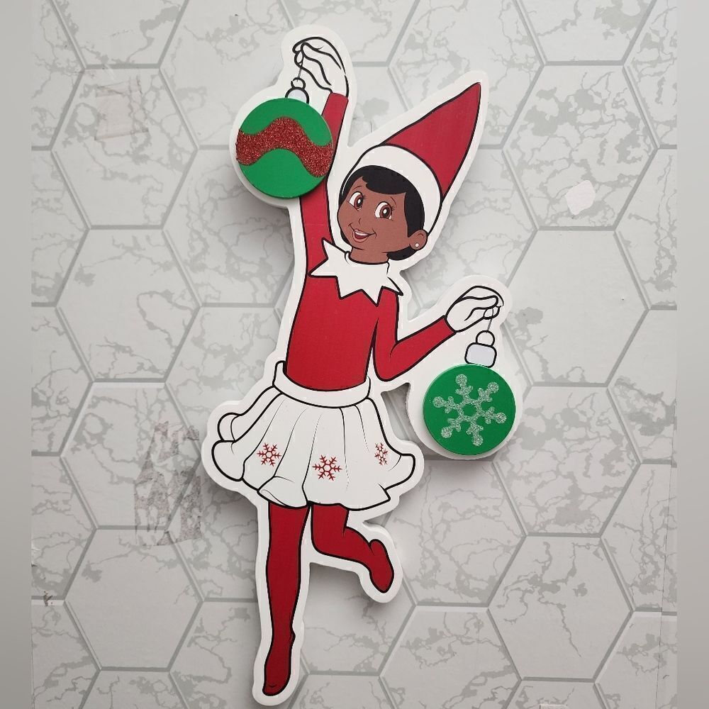 The Elf on the Shelf Scout Elf Brown Eye Girl Cut Out Wall Decor,13x18 Faux Wood